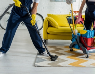 cropped view of cleaners in overalls cleaning apar XXJP3SX